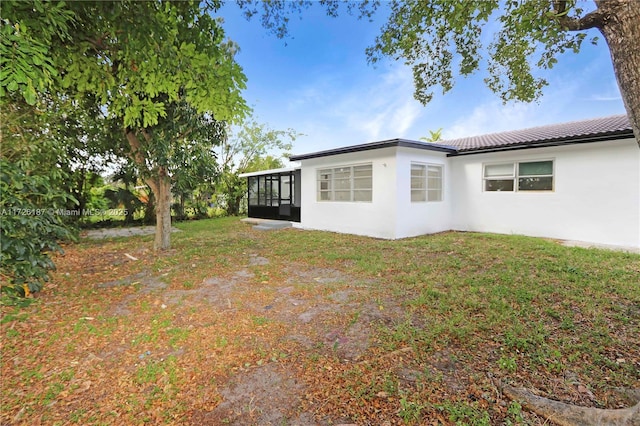 exterior space featuring a sunroom