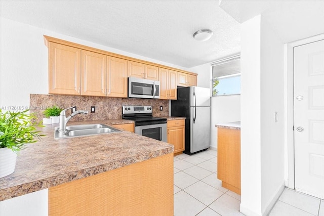 110 Lake Emerald Dr Unit 403, Oakland Park, FL 33309 - kitchen featuring decorative backsplash, light brown cabinetry, light tile patterned floors, stainless steel appliances, and a sink