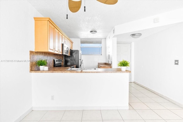 110 Lake Emerald Dr Unit 403, Oakland Park, FL 33309 - kitchen with appliances with stainless steel finishes, light countertops, baseboards, and a sink