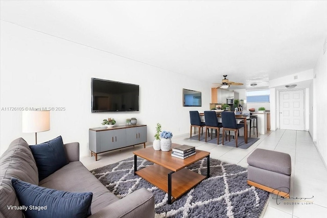 110 Lake Emerald Dr Unit 403, Oakland Park, FL 33309 - living area featuring light tile patterned floors and ceiling fan