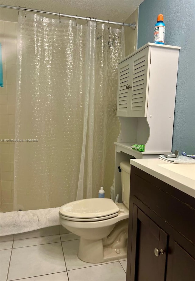 bathroom featuring a textured ceiling, a shower with curtain, toilet, tile patterned floors, and vanity