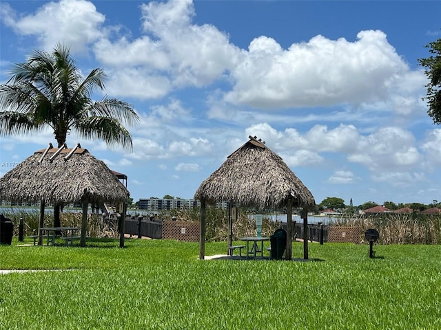 view of property's community with a yard and a gazebo