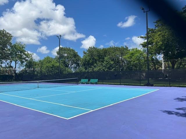 110 Lake Emerald Dr Unit 403, Oakland Park, FL 33309 - view of sport court featuring fence