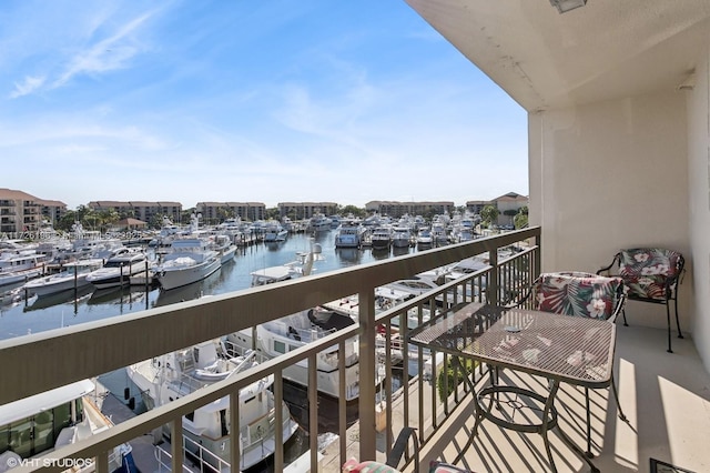 balcony featuring a water view