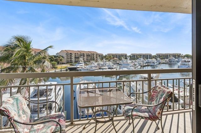 balcony featuring a water view