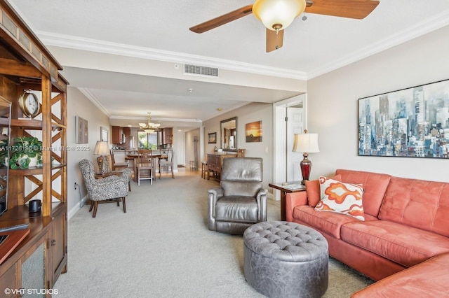 living room featuring ceiling fan with notable chandelier, crown molding, and carpet flooring