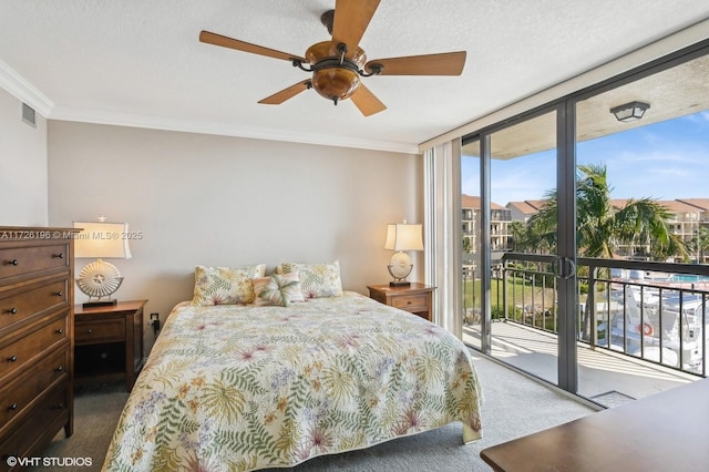 bedroom with ceiling fan, carpet floors, access to exterior, floor to ceiling windows, and crown molding