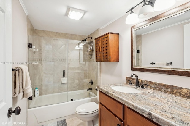 full bathroom with toilet, vanity, shower / bath combination with glass door, and crown molding