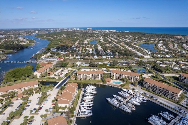 birds eye view of property with a water view