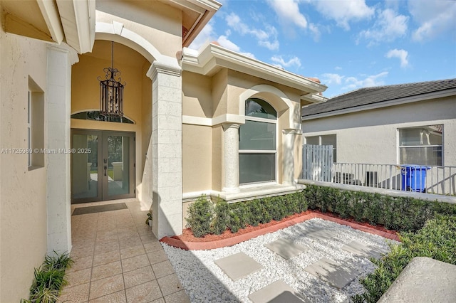 view of exterior entry featuring french doors