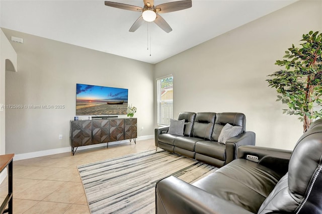 living room featuring light tile patterned flooring and ceiling fan