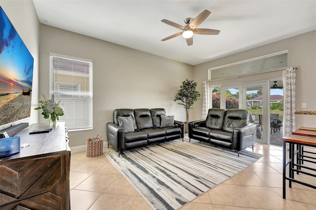 living room featuring french doors, ceiling fan, and light tile patterned floors