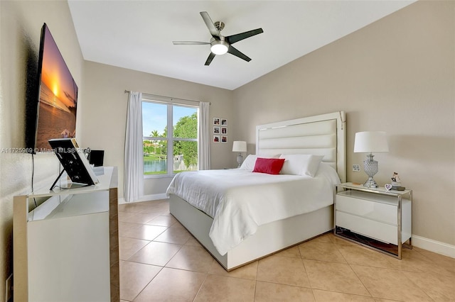 tiled bedroom with ceiling fan