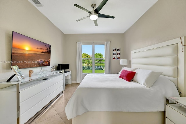 tiled bedroom featuring ceiling fan