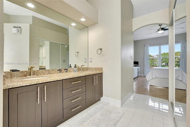 bathroom featuring ceiling fan, tile patterned flooring, and vanity