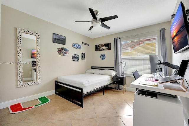 bedroom with ceiling fan and light tile patterned floors