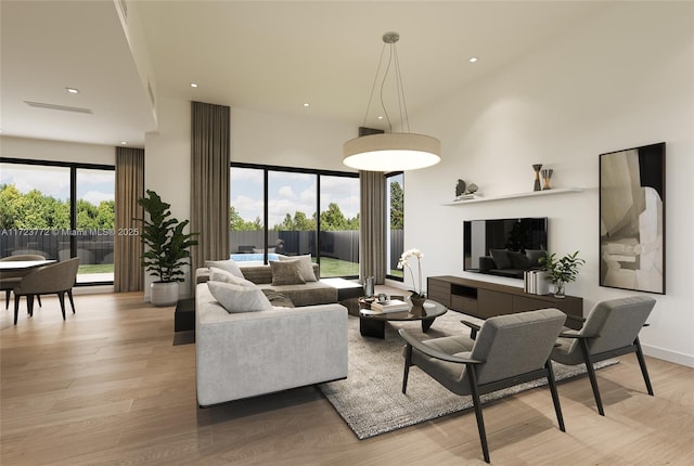 living room featuring a healthy amount of sunlight and light wood-type flooring