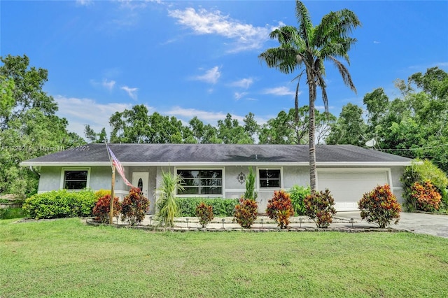 ranch-style home featuring a front yard and a garage