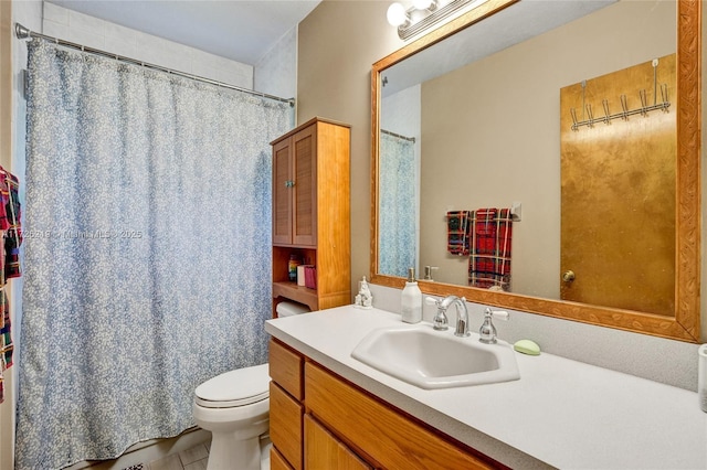 bathroom with toilet and vanity