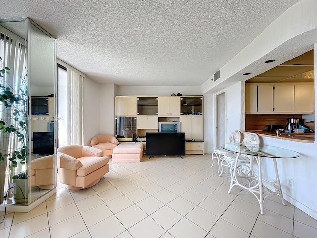 living room with light tile patterned flooring