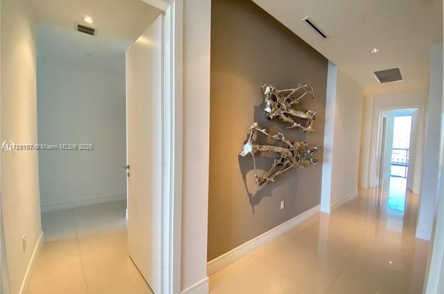 hallway featuring light tile patterned floors