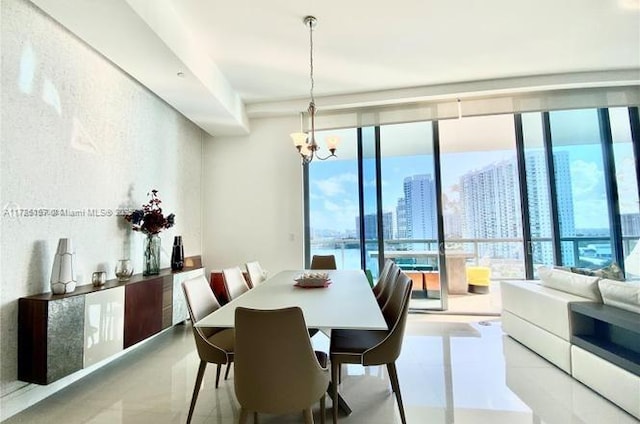 dining area with light tile patterned floors, a chandelier, and floor to ceiling windows