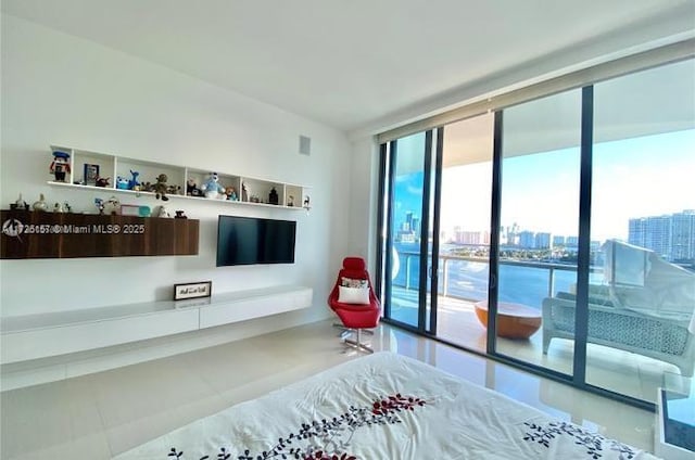 bedroom featuring access to outside and expansive windows