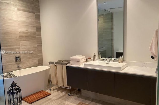 bathroom featuring a bathing tub and vanity