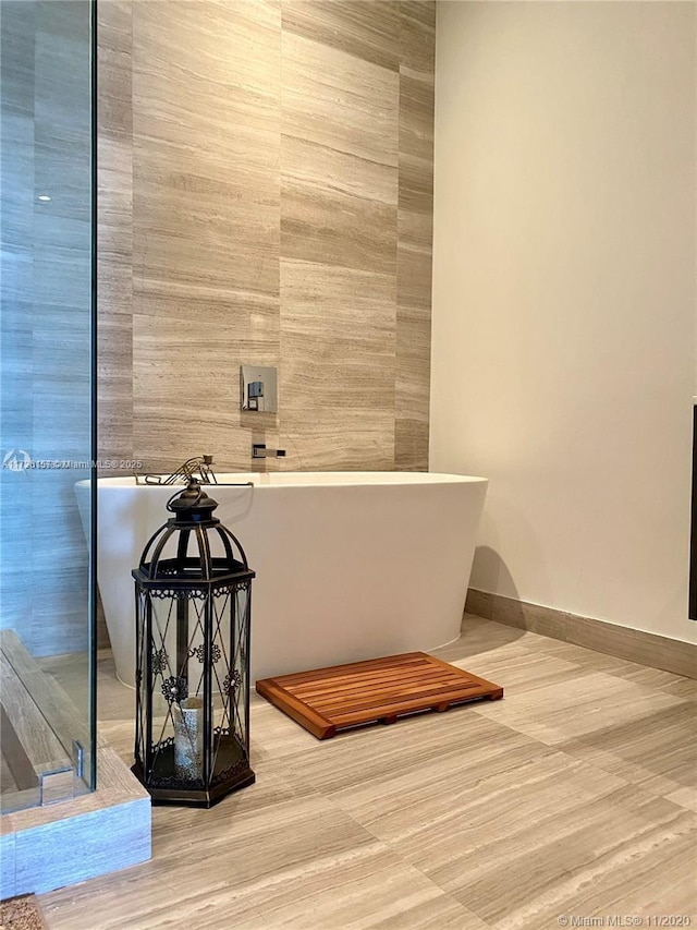 bathroom featuring a tub to relax in