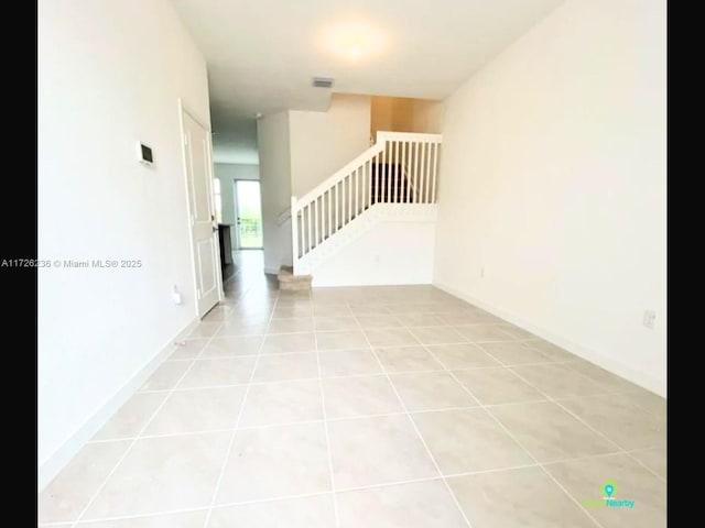 view of tiled spare room