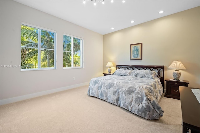 bedroom featuring light carpet