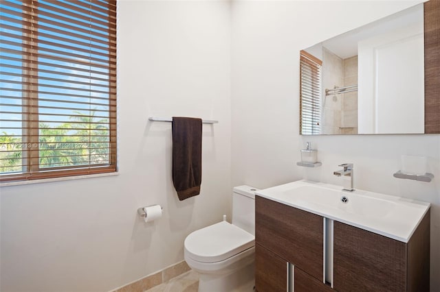 bathroom featuring toilet and vanity