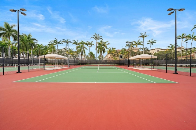 view of tennis court featuring basketball court