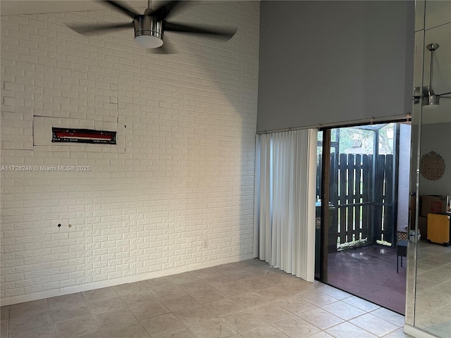 interior space with ceiling fan and a patio