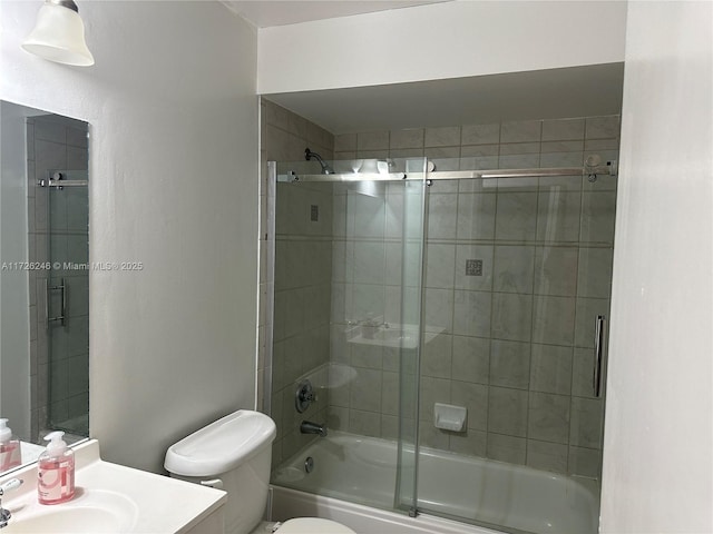 full bathroom with toilet, vanity, and combined bath / shower with glass door