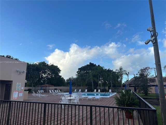 view of swimming pool featuring a patio area