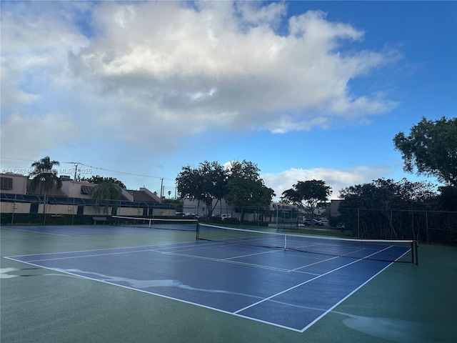 view of tennis court featuring basketball court