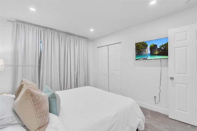 bedroom with a closet and carpet flooring