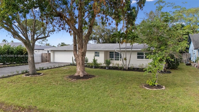 ranch-style house with a front lawn and a garage