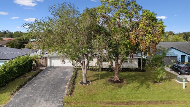 obstructed view of property featuring a front yard