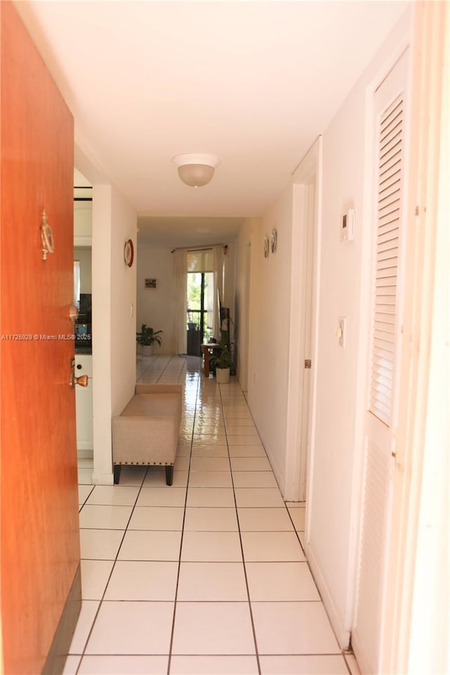 corridor with light tile patterned flooring