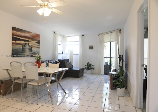 dining room featuring ceiling fan and light tile patterned flooring