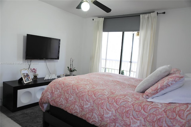 bedroom featuring ceiling fan and carpet