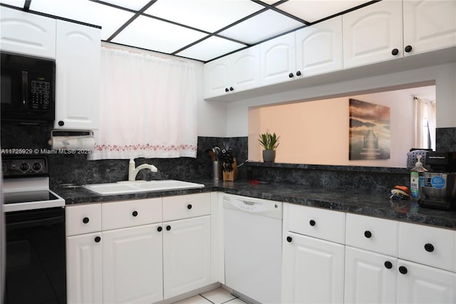 kitchen featuring white dishwasher, white cabinets, black microwave, and electric range