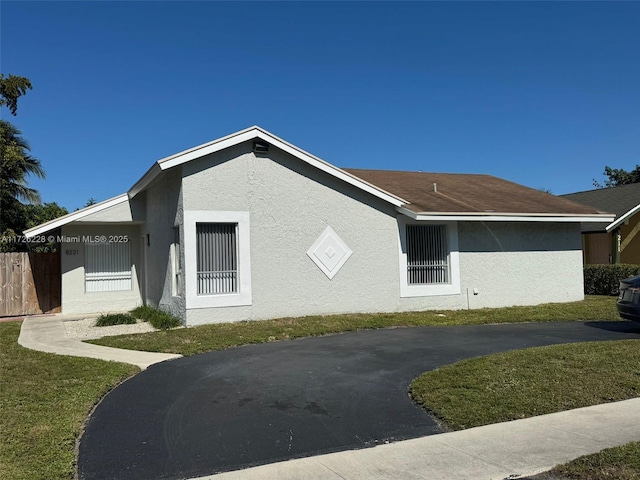 view of property exterior featuring a yard