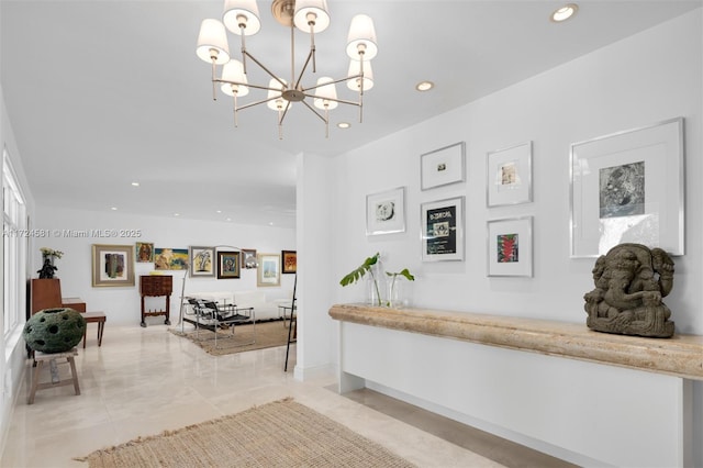 hallway with an inviting chandelier