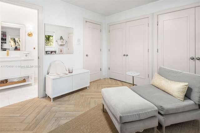 living area with light parquet flooring