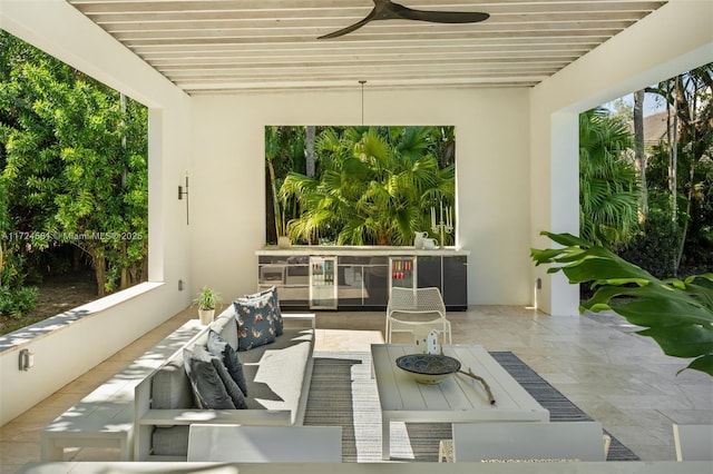 view of patio / terrace featuring ceiling fan and an outdoor living space