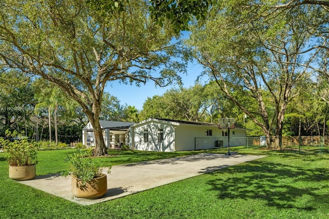 rear view of house featuring a lawn