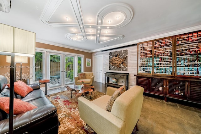 living room with ornamental molding and french doors